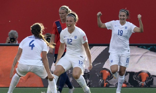 England’s Lucy Bronze, centre, celebrates with teammate Fara Williams, left, as Jodie Taylor ...