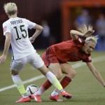 
              Germany's Lena Goessling, right, and United States' Megan Rapinoe (15) vie for the ball during the first half of a semifinal in the Women's World Cup soccer tournament, Tuesday, June 30, 2015, in Montreal, Canada. (Ryan Remiorz/The Canadian Press via AP)
            