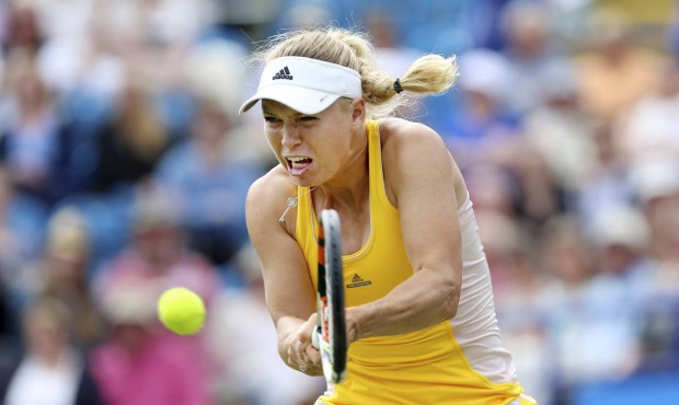 Denmark’s Caroline Wozniacki in action against Australia’s Jarmila Gajdosova during day...