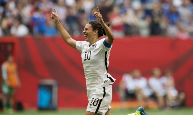 United States’ Carli Lloyd (10) celebrates her third goal against Japan during first half act...