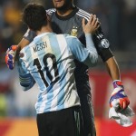 
              Argentina's Lionel Messi celebrates with teammate goalkeeper Sergio Romero  after the penalty shootout during a Copa America quarterfinal soccer match at the Sausalito Stadium in Vina del Mar, Chile, Friday, June 26, 2015. Argentina defeated Colombia 5-4 on penalties after a 0-0 draw on Friday to reach the semifinals of the Copa America.(AP Photo/Andre Penner)
            
