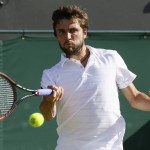 
              Gilles Simon of Franc returns a ball to Tomas Berdych of the Czech Republic during their singles match at the All England Lawn Tennis Championships in Wimbledon, London, Monday July 6, 2015. (AP Photo/Kirsty Wigglesworth)
            