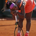 
              Serena Williams of the U.S. leans on her racket in her semifinal match of the French Open tennis tournament against Timea Bacsinszky of Switzerland at the Roland Garros stadium, in Paris, France, Thursday, June 4, 2015. (AP Photo/Francois Mori)
            