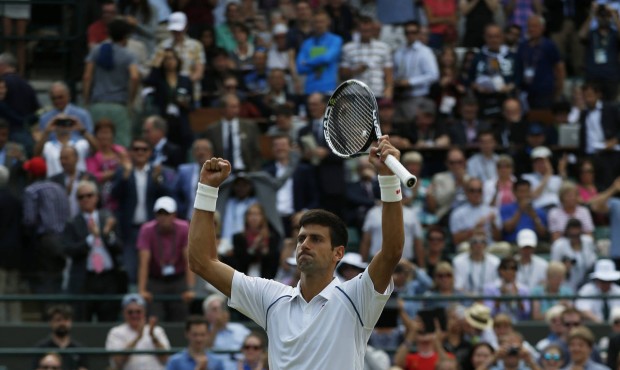 Novak Djokovic of Serbia celebrates winning the singles match against Kevin Anderson of South Afric...