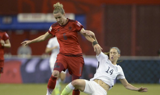 Germany’s Simone Laudehr (6) and United States’ Morgan Brian (14) battle for the ball d...