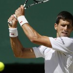 
              Novak Djokovic of Serbia returns a shot to Richard Gasquet of France during the men's singles semifinal match at the All England Lawn Tennis Championships in Wimbledon, London, Friday July 10, 2015. (AP Photo/Kirsty Wigglesworth)
            
