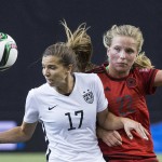 
              United States' Tobin Heath, left, challenges Germany's Tabea Kemme during the first half of a semifinal in the Women's World Cup soccer tournament, Tuesday, June 30, 2015, in Montreal, Canada. (Graham Hughes/The Canadian Press via AP)
            