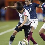 
              Germany's Celia Sasic, left, sheilds the ball from France's Louisa Necib during the first half of a FIFA Women's World Cup quarterfinal soccer game, Friday, June 26, 2015, in Montreal, Canada. (Ryan Remiorz/The Canadian Press via AP) MANDATORY CREDIT
            