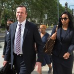 
              CORRECTS MONTH TO JULY, NOT JUNE - Defense attorney Edward O'Callaghan and Kendra Gamble-Webb leave the courthouse following the arraignment of former FIFA official Jeffrey Webb in Federal Court in Brooklyn on racketeering and bribery charges Saturday, July 18, 2015, in New York. (AP Photo/Bryan R. Smith)
            
