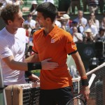 
              Britain's Andy Murray, left, congratulates Serbia's Novak Djokovic who won the semifinal match of the French Open tennis tournament in five sets 6-3, 6-3, 5-7, 5-7, 6-1, at the Roland Garros stadium, in Paris, France, Saturday, June 6, 2015. (AP Photo/David Vincent)
            