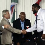 
              International Boxing Hall of Fame inductee, Riddick Bowe, right, shakes hands with Nino Benvenuti, second from left, while fellow inductee, Steve Smoger, left, and Hall of Fame alumni, Richard Steele, look on during the International Boxing Hall of Fame induction ceremony in Canastota, N.Y., Sunday, June 14, 2015. (AP photos/Heather Ainsworth)
            