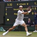 
              Roger Federer of Switzerland plays a return to Novak Djokovic of Serbia during the men's singles final at the All England Lawn Tennis Championships in Wimbledon, London, Sunday July 12, 2015. (Toby Melville/Pool Photo via AP)
            