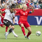 
              England's Steph Houghton (5) and Germany's Celia Sasic vie for the ball during first-half action of a FIFA Women's World Cup soccer game in Edmonton, Alberta, Canada, on Saturday, July 4, 2015. (Jason Franson/The Canadian Press via AP) MANDATORY CREDIT
            
