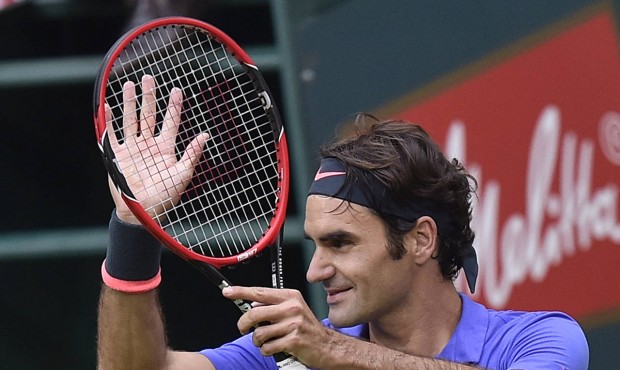 Roger Federer of Switzerland reacts to supporters after winning the quarterfinal match against Flor...