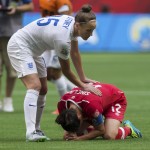 
              England's Casey Stoney, left, consoles Canada's Christine Sinclair after England's 2-1 win during a quarterfinal of the Women's World Cup soccer tournament, Saturday, June 27, 2015, in Vancouver, British Columbia, Canada. (Darryl Dyck/The Canadian Press via AP)
            