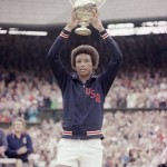 
              FILE - In this July 5, 1975 file photo, Arthur Ashe holds the men's singles trophy after defeating fellow American Jimmy Conners in the final of the men's singles championship at the All England Lawn Tennis Championship in Wimbledon, London. Ashe became the first, and only, black man to win Wimbledon when he defeated Connors in the 1975 final. Ashe was a key force behind the creation of the Association of Tennis Professionals. He died in 1993 after Aids-related complications connected to a blood transfusion during a heart operation. He spent much of his final days raising awareness of the disease.  (AP Photo, File)
            