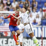 
              South Korea midfielder Cho Sohyun, left, and United States forward Abby Wambach (20) go up for the ball during the first half of an international friendly soccer match, Saturday, May 30, 2015, in Harrison, N.J. (AP Photo/Julio Cortez)
            