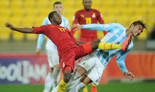 Ghana’s Yaw Yeboah, left, and Argentina’s Rodrigo Moreira clash as they attempt to get ...