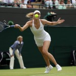 
              Maria Sharapova of Russia makes a return to Zarina Diyas of Kazakhstan, during their singles match at the All England Lawn Tennis Championships in Wimbledon, London, Monday July 6, 2015. (AP Photo/Tim Ireland)
            
