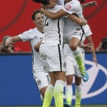 
              United States' Christen Press (23) celebrates her goal against Australia with Lauren Holiday (12) during a FIFA Women's World Cup soccer match in Winnipeg, Manitoba, Monday, June 8, 2015. (John Woods/The Canadian Press via AP) MANDATORY CREDIT
            