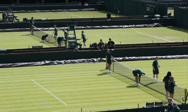 Courts are prepared ahead of the first day of play at the All England Lawn Tennis Championships in ...