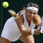 
              Victoria Azarenka of Belarus returns a ball to   Belinda Bencic of Switzerland, during their singles match at the All England Lawn Tennis Championships in Wimbledon, London, Monday July 6, 2015. (AP Photo/Kirsty Wigglesworth)
            
