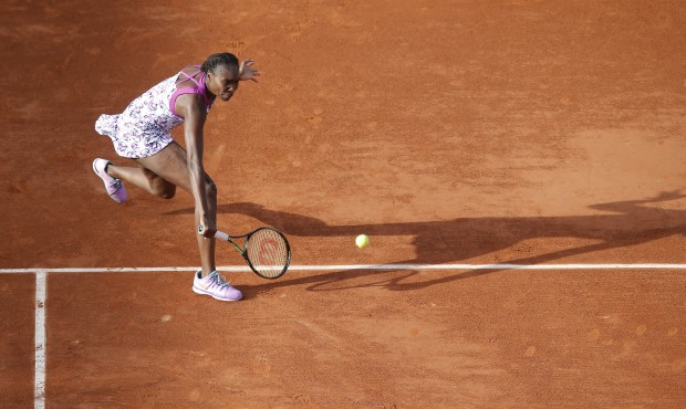 Venus Williams of the U.S. returns in the first round match of the French Open tennis tournament ag...