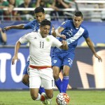 
              Mexico forward Carlos Vela (11) gets tackled by Guatemala defenseman Jorge Aparicio during the first half of a CONCACAF Gold Cup soccer match Sunday, July 12, 2015, in Glendale, Ariz. (AP Photo/Rick Scuteri)
            