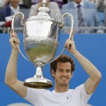 
              Andy Murray of Britain holds up the winners trophy after winning the final tennis match against Kevin Anderson of South Africa at the tennis Championships at Queens Club in London, Sunday, June 21, 2015. (AP Photo/Kirsty Wigglesworth)
            