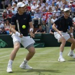 
              Britain's Andy Murray, left, and Jamie Murray during their doubles match against France's Jo-Wilfried Tsonga and Nicolas Mahut during the quarterfinal match of the Davis Cup at the Queen's Club in London, Saturday July 18, 2015. (AP Photo/Tim Ireland)
            
