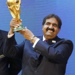 
              FILE - In this Thursday Dec. 2, 2010 file photo, Sheikh Hamad bin Khalifa Al-Thani, Emir of Qatar, holds the World Cup trophy after the announcement of Qatar hosting the 2022 soccer World Cup in Zurich, Switzerland. FIFA has been routinely called “scandal-plagued” for much of Sepp Blatter’s 17-year presidential reign. The FIFA executive committee’s choice of Qatar as 2022 World Cup host was the explosive event of Blatter's third term and dominated his fourth. Cases of unethical behavior by some voters are still open. (AP Photo/Anja Niedringhaus, File)
            