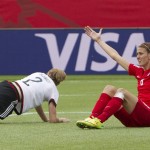 
              England's Jill Scott (8) reacts to a call as Germany's Bianca Schmidt (2) gets up during second-half action of the FIFA Women's World Cup soccer third-place match in Edmonton, Alberta, Canada, on Saturday, July 4, 2015. (Jason Franson/The Canadian Press via AP) MANDATORY CREDIT
            