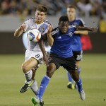
              Los Angeles Galaxy's Steven Gerrard, left, of England, and San Jose Earthquakes's Fatai Alashe race for the ball during the first half of an MLS soccer match, Friday, July 17, 2015, in Carson, Calif. (AP Photo/Jae C. Hong)
            