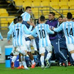 
              Argentina's Angel Correa, top, is congratulated by teammates after scoring goal against Panama during their U20 soccer World Cup match in Wellington, New Zealand, Saturday, May 30, 2015. (AP Photo/Ross Setford)
            