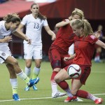 
              United States' Tobin Heath, left, has a shot blocked by Germany's Tabea Kemme (22) during the first half of a semifinal in the Women's World Cup soccer tournament, Tuesday, June 30, 2015, in Montreal, Canada. (Graham Hughes/The Canadian Press via AP)
            