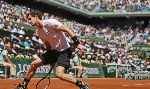 Britain’s Andy Murray misses a return in his semifinal match of the French Open tennis tourna...