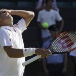 
              Kei Nishikori of Japan reacts after defeating Simone Bolelli of Italy in the men's singles first round match at the All England Lawn Tennis Championships in Wimbledon, London, Monday June 29, 2015. (AP Photo/Pavel Golovkin)
            