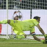 
              Chile's goalkeeper Claudio Bravo saves a penalty kick by Argentina's Ever Banega   during the Copa America final soccer match at the National Stadium in Santiago, Chile, Saturday, July 4, 2015. (AP Photo/Ricardo Mazalan)
            