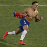 
              Chile's Alexis Sanchez celebrates after scores the winning penalty kick against Argentina  during the Copa America final soccer match at the National Stadium in Santiago, Chile, Saturday, July 4, 2015. (AP Photo/Silvia Izquierdo)
            