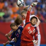 
              Netherlands' Anouk Dekker, back right, gets her head on the ball but fails to score as Japan goalkeeper Ayumi Kaihori (18) reaches for the ball and Rumi Utsugi (13) defends during the second half of a round of 16 soccer match at the FIFA Women's World Cup, Tuesday, June 23, 2015, in Vancouver, British Columbia, Canada. (Darryl Dyck/The Canadian Press via AP)
            