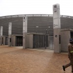 
              A man passes the entrance used by fans at the Cape Town Soccer stadium that hosted some games during the 2010 World Cup in Cape Town, South Africa, Thursday, May 28, 2015. The image of South Africa’s 2010 World Cup has been shattered by allegations that its bid over a decade ago was involved in bribes of more than $10 million to secure FIFA votes possibly with the knowledge or involvement of the South African government. (AP Photo/Schalk van Zuydam)
            