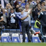 
              Chelsea's Didier Drogba, center left, hugs head coach Jose Mourinho in a lineup before the English Premier League soccer match between Chelsea and Sunderland at Stamford Bridge stadium in London, Sunday, May 24, 2015.  (AP Photo/Matt Dunham)
            