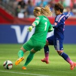 
              CORRECTS PHOTOGRAPHER - Netherlands goalkeeper Loes Geurts, left, is challenged by Japan's Shinobu Ohno during the first half of a round of 16 soccer match at the FIFA Women's World Cup, Tuesday, June 23, 2015, in Vancouver, British Columbia, Canada. (Darryl Dyck/The Canadian Press via AP)
            