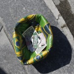 
              A soccer ball designed with Brazil's national colors, formed by a street performer into a receptacle to collect tips left by tourists, sits in front of the Maracana Stadium, in Rio de Janeiro, Brazil, Wednesday, May 27, 2015. Brazilian Jose Maria Marin, the former president of the Brazilian Football Confederation, was among seven high-ranking soccer officials arrested Wednesday in Zurich on U.S. charges of corruption. (AP Photo/Silvia Izquierdo)
            