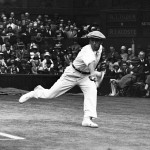 
              FILE - In this July 4, 1928 file photo, French tennis champion Rene Lacoste returns a shot,  during the men's singles semi-final match against American Bill Tilden, on the Centre Court at the All England Lawn Tennis Championships in Wimbledon, London. In the 1920s, French players dominated Wimbledon. In addition to Suzanne Lenglen winning five Wimbledon titles, three different Frenchmen triumphed, Rene Lacoste probably the most famous because of the clothing range he co-founded in 1933. Lacoste won two Wimbledons, as did his peers Jean Borotra and Henri Cochet, all between 1924 and 1929. (AP Photo, File)
            