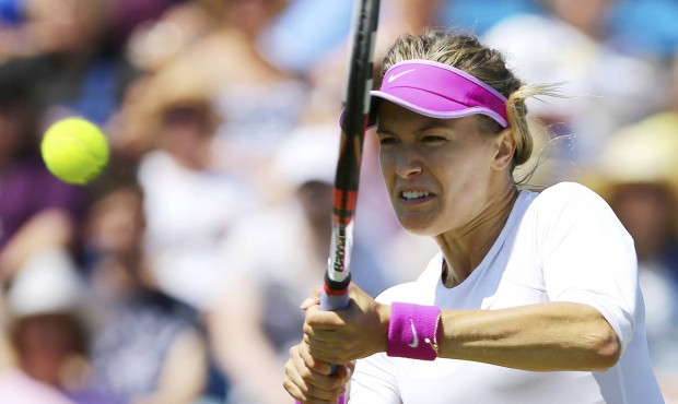 Canada’s Eugenie Bouchard returns the ball to Belinda Bencic during day five of the women&#82...