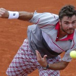 
              Switzerland's Stan Wawrinka serves the ball to France's Gilles Simon during their fourth round match of the French Open tennis tournament at the Roland Garros stadium, Sunday, May 31, 2015 in Paris, France. (AP Photo/Christophe Ena)
            