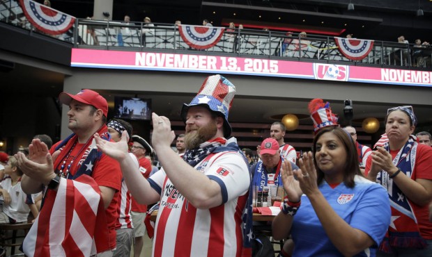 Soccer fans applaud during a news conference Monday, July 27, 2015, in St. Louis. The news conferen...