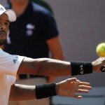 
              France's Jo-Wilfried Tsonga returns in the semifinal match of the French Open tennis tournament against Switzerland's Stan Wawrinka at the Roland Garros stadium, in Paris, France, Friday, June 5, 2015. (AP Photo/Michel Euler)
            