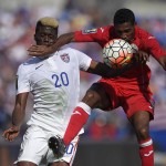 
              United States midfielder Gyasi Zardes (20) battles for the ball against Cuba defender Yaisnier Napoles, right, during the first half of a CONCACAF Gold Cup soccer quarterfinal match, Saturday, July 18, 2015, in Baltimore. (AP Photo/Nick Wass)
            